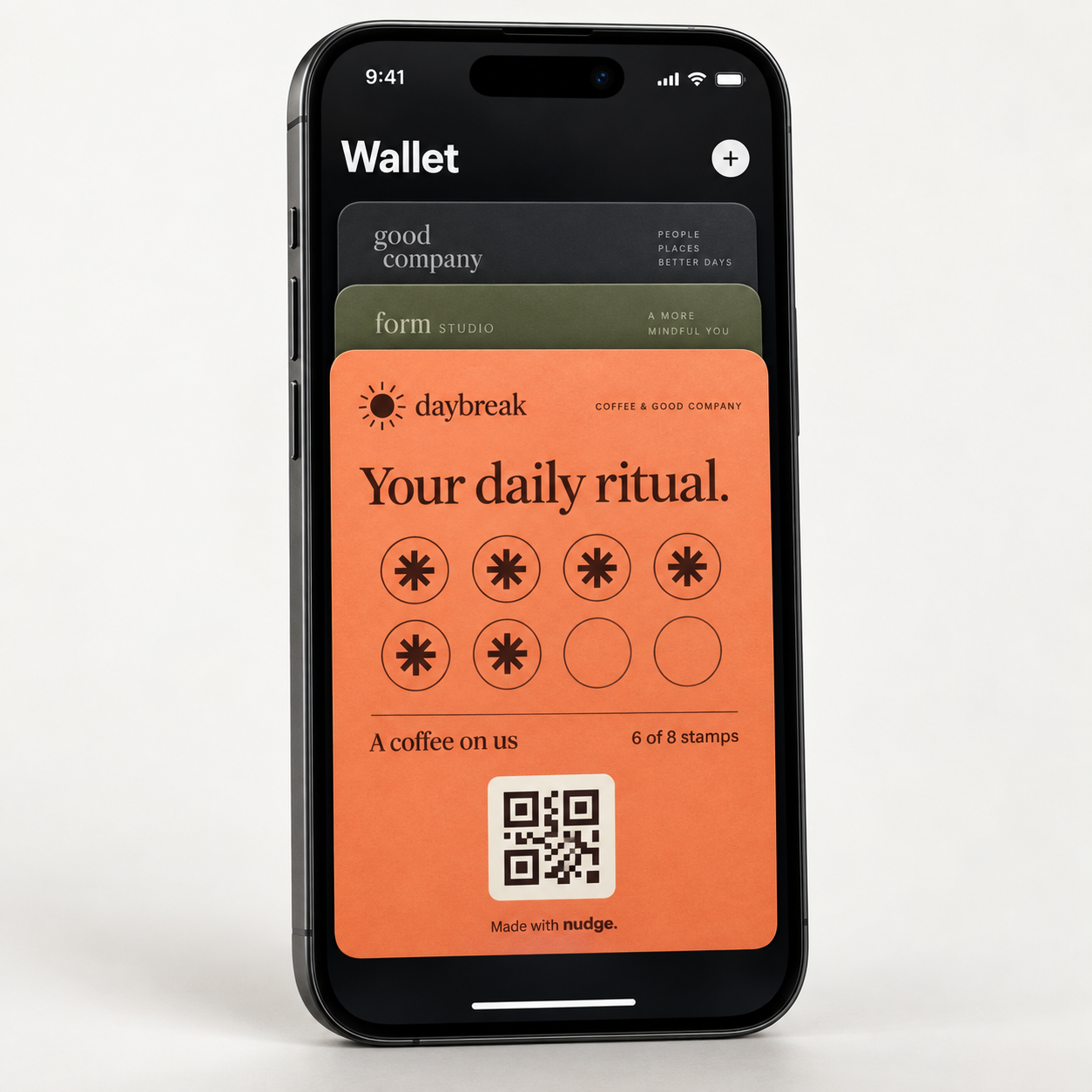 Illustrative iPhone mockup showing a coral Daybreak Coffee loyalty card in Wallet, with six of eight stamps collected and additional branded passes behind it.